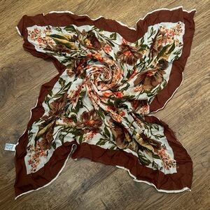 A pretty brown medium sized floral scarf!